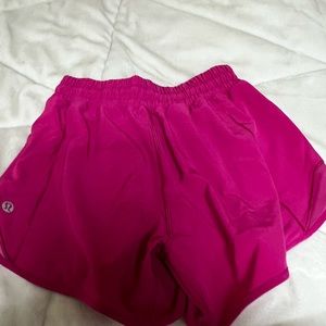 Lululemon, size 2, brighter pink than picture. lining cut out. Only wore once